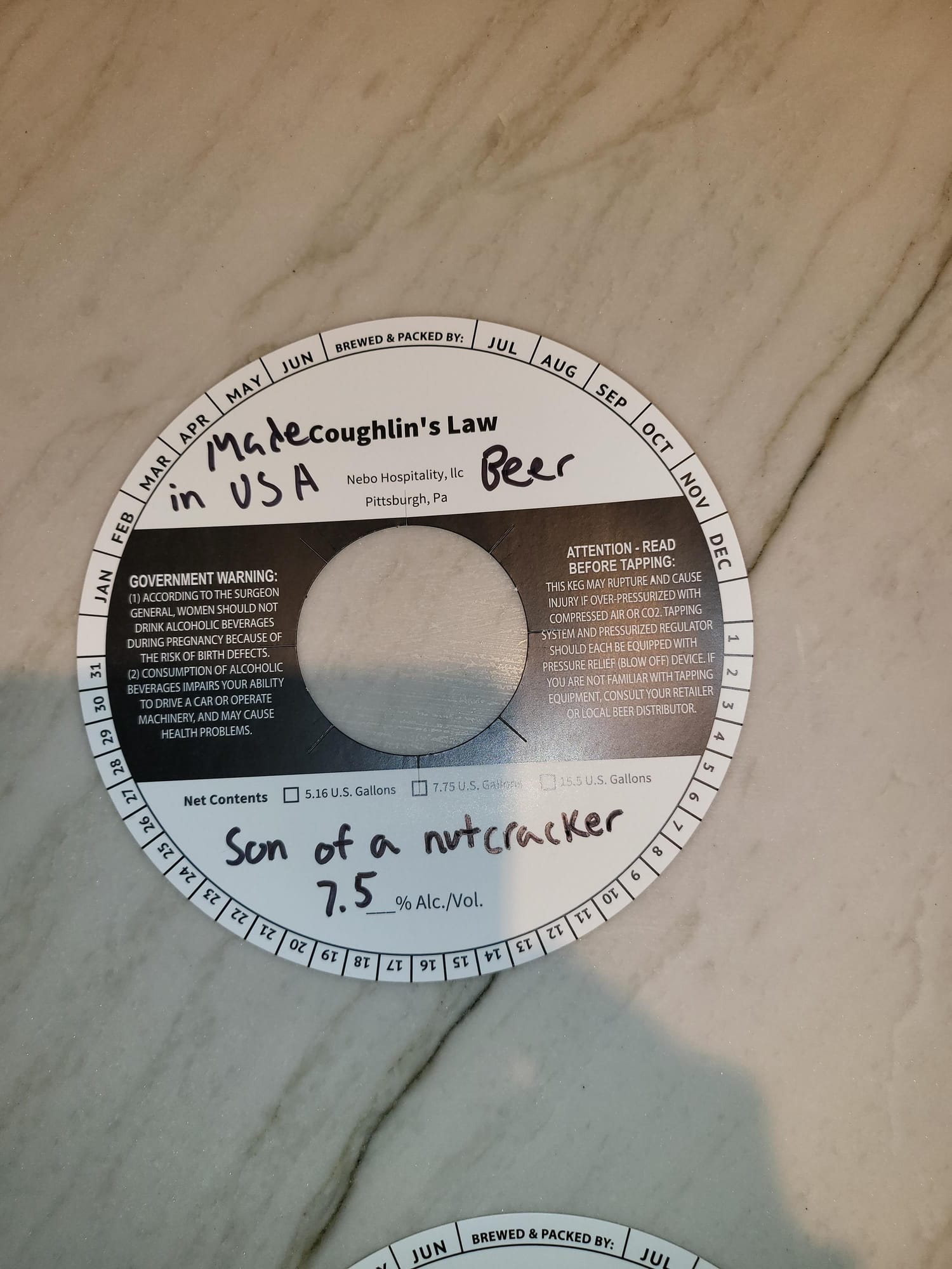 Madecaughin’s Law Beer by Nebuto Hospitality, llc - beer label